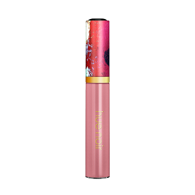 Elegant Hue Noir lip gloss in soft pink with floral cap, delivering a luminous finish and hydrating comfort all day.