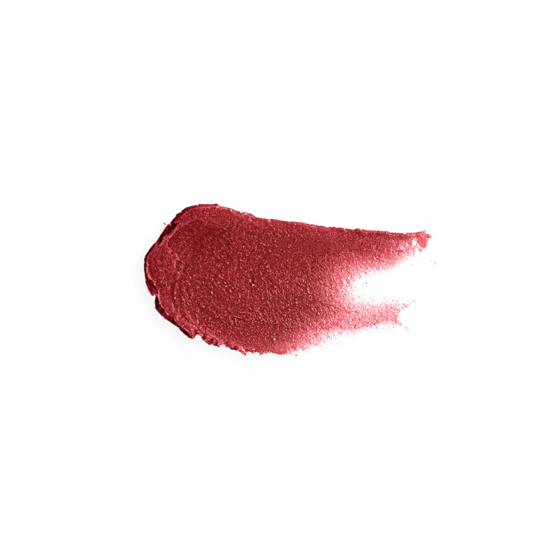 Smear of ruby red tinted lip balm showing red color and creamy texture