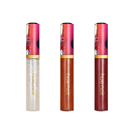 Set of three lip gloss in nude, bronze and deep red colors