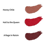 Swatches of three lipsticks in nude, red, and purple-mauve colors