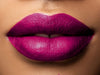 Fuchsia lipstick on medium brown skin