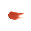 Smear of copper tinted lip balm showing copper color and texture
