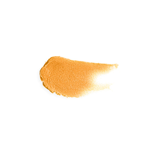 Smear of gold tinted lip balm to show gold color and creamy texture