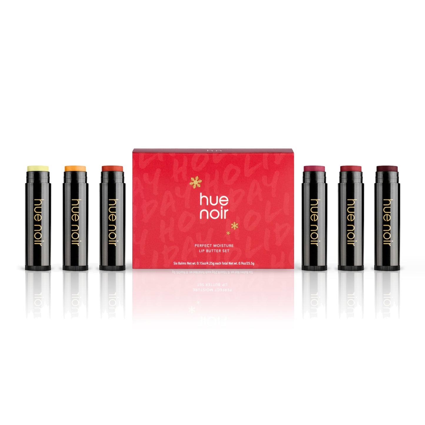 tinted lip balm set of six with clear, gold, copper, rose, ruby and wine shades along with red holiday themed product carton