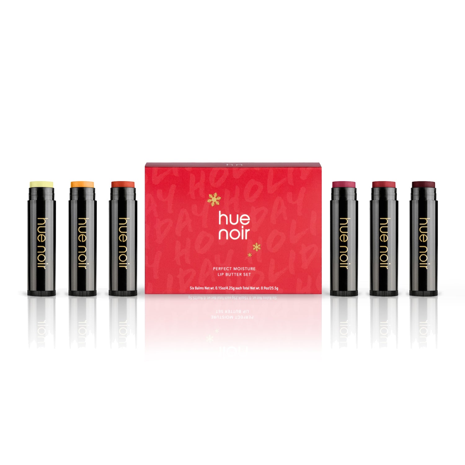 tinted lip balm set of six with clear, gold, copper, rose, ruby and wine shades along with red holiday themed product carton