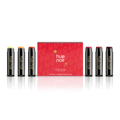 tinted lip balm set of six with clear, gold, copper, rose, ruby and wine shades along with red holiday themed product carton